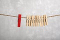 Clothespins on rope. Difference from others. Separate from the crowd. Leadership concept