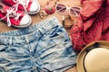 Clothing and accessories for women with summer on wood floor. Royalty Free Stock Photo