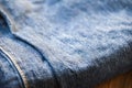 Clothing denim jeans texture Close up of blue Jeans pattern fold on wooden table background Royalty Free Stock Photo