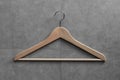 Clothing hanger on cement wall Royalty Free Stock Photo