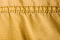 clothing items stonewashed cotton fabric texture with seams, clasps, buttons and rivets, macro