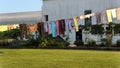 A clothes line with Amish clothing, hanging out to dry in the morning sunlight