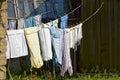 Clothing and linen dries after washing in the yard on a sunny day Royalty Free Stock Photo