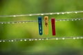 clothing lines of a clothes spin with many raindrops at the string in front of a dark background, after the rain. Retro way of Royalty Free Stock Photo