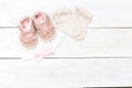 Clothing for little girl and accessories on a white wooden background. Copy space Royalty Free Stock Photo