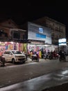 a clothing and mukena shop frequented by visitors on Jalan Panglima Aim, Pontianak, Indonesia