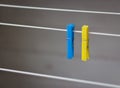 Clothing peg on washing line. Clothing pins on clothesline. Clothes pin in ukrainian colors. Blue and yellow pegs. Laundry concept Royalty Free Stock Photo