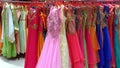 Clothing racks with colored wedding dresses Royalty Free Stock Photo