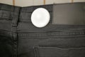 Clothing security tag on a jeans , Royalty Free Stock Photo