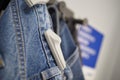 Clothing security tag on a jeans , Royalty Free Stock Photo