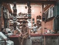 Clothing shop with traditional clothes and male sellers in it, Peshawar, Pakistan