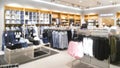 Abstract blurred showcases fashion boutique shop background in modern shopping mall, jeans zone