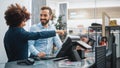 Clothing Store Checkout Cashier Counter: Female Retail Sales Manager Explaining to New Male Royalty Free Stock Photo