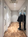 Clothing store, dressing room with lifeless mannequin