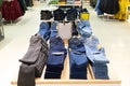Clothing store with a large assortment of pants and jeans hanging on hanger