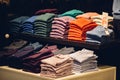 Stack of folded colorful clothes in a clothing store Royalty Free Stock Photo