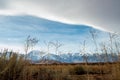 Cloud bank above snowy Sierra Nevada mountain range