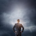 Cloud and businessman looking at empty space Royalty Free Stock Photo