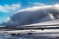 Cloud caught on the glacial sheet, nunatak in fog Royalty Free Stock Photo