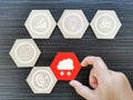 Cloud computing business concept with icons on wooden hexagon.