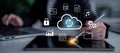 Cloud Computing Concept with Digital Interface Elements, Data Security, and Technology in Modern Workspace with Laptops Royalty Free Stock Photo