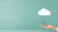 Cloud Computing Concept, Hand holding a glowing cloud icon, symbolizing data storage and cloud technology Royalty Free Stock Photo
