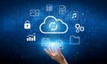 Cloud Computing Concept with Hand Reaching Towards Icons for Data Storage, Security, Multimedia, and Analytics in Royalty Free Stock Photo