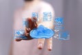 Hand interacting with cloud computing network, showcasing data storage, access, and connectivity Royalty Free Stock Photo