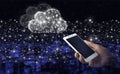 Cloud computing technology internet concept background. Hand hold white smartphone with digital hologram cloud sign on city dark Royalty Free Stock Photo