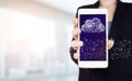 Cloud computing technology internet concept background. Hand hold white smartphone with digital hologram cloud sign on light Royalty Free Stock Photo