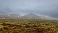 Cloud cover mountains in the middle of Tundra landscape in Iceland