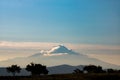 Cloud covered mountain peak at sunrise Royalty Free Stock Photo