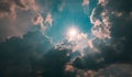 Cloud-filled sky, with a bright beam of sunlight breaking through the clouds Royalty Free Stock Photo