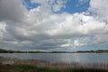 A cloud filled sky over a lake in Everglades National Park, FL.