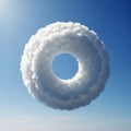 Cloud is fluffy with a distinct hole in the center, suspended in a clear Royalty Free Stock Photo