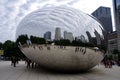 Cloud Gate sculpture, aka The Bean, with clouds and buildings reflected in it. By artist Anish Kapoor, 2006. Royalty Free Stock Photo