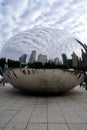 Cloud Gate sculpture, aka The Bean, with clouds and buildings reflected in it. By artist Anish Kapoor, 2006. Royalty Free Stock Photo