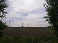 cloud grass sky field agriculture summer Germany Northrhine-Westphalia Windmill sustainable energy Royalty Free Stock Photo