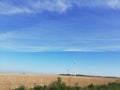 cloud grass sky field agriculture summer Germany Northrhine-Westphalia Windmill sustainable energy Royalty Free Stock Photo