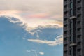 Cloud iridescence cloud in rainbow colors with a high-rise building in Bangkok