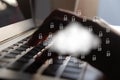 Cloud and lock icon on hand and keyboard background.Cloud computing and network security concept Royalty Free Stock Photo