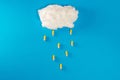 Cloud made of foam on blue background with pills as rain drops Royalty Free Stock Photo