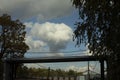 Cloud over garages. White cloud in sky. Weather in summer