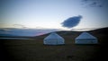 Cloud over the yurts at the shore of Song Kol Lake at the dawn, Kyrgyzstan Royalty Free Stock Photo