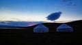 Cloud over the yurts at the shore of Song Kol Lake at dawn, Kyrgyzstan