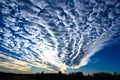 Cloud band in blue sky. Rippled altocumulus clouds spreading out. Cloud pattern on cloud band in blue sky Royalty Free Stock Photo