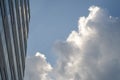 Cloud reflected in business building windows