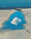 Cloud Reflection in Blue Puddle on Concrete Royalty Free Stock Photo