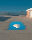 Cloud Reflection in a Rooftop Puddle Royalty Free Stock Photo