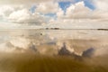 Cloud reflection in the Wadden Sea at the North Sea